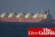 Oil tumbles 10% and stock markets rally as Iran declares strait of Hormuz ‘completely open’ – as it happened | Business