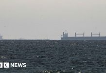 Strait of Hormuz closed again, Iran says, as ships attacked – BBC