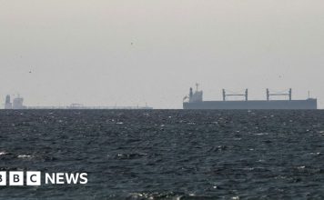 Strait of Hormuz closed again, Iran says, as ships attacked – BBC