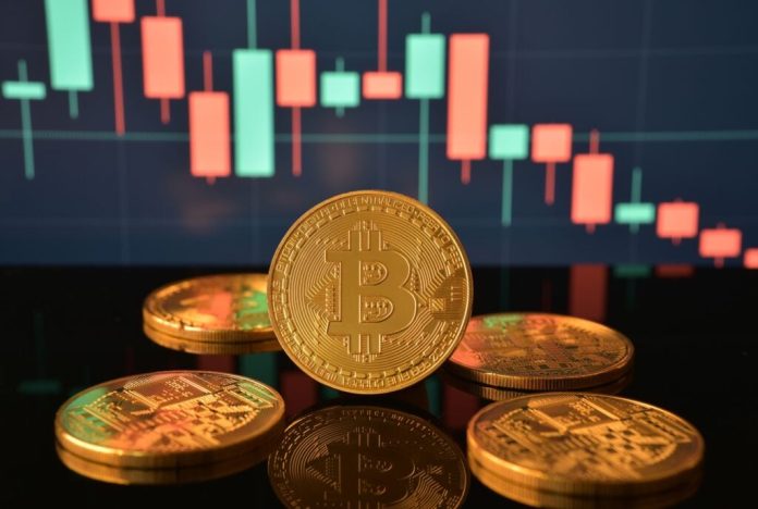 Bitcoin-Coins-On-Reflective-Black-Surfac.jpg