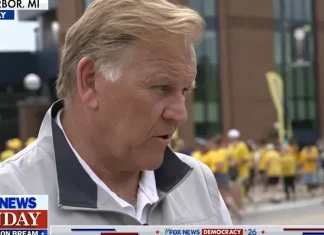 Football and politics merge at Michigan tailgate as Senate candidates mingle with attendees