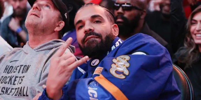 drake-attends-a-game-between-the-houston-rockets-and-the-cleveland-cavaliers-at-toyota-center-on-mar.webp