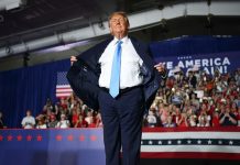 Photos of Trump’s cheap suit have gone viral. Here’s why